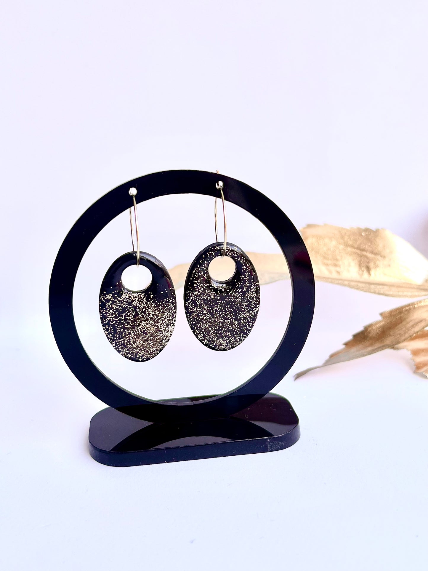 Black Hoop Earrings with a Touch of Gold Glitter
